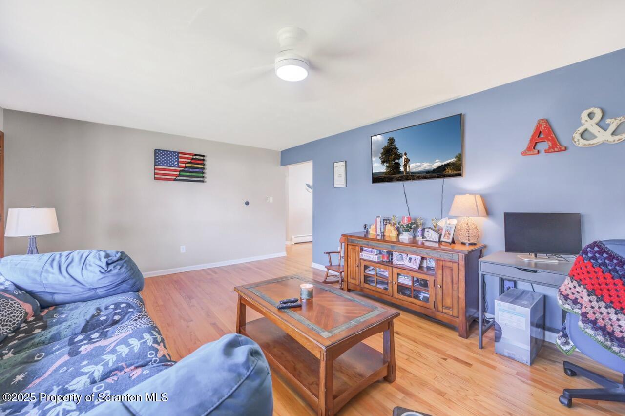 151 Primrose Avenue Clarks Summit, PA 18411 - Photo 8 of 58 a living room with furniture and a couch