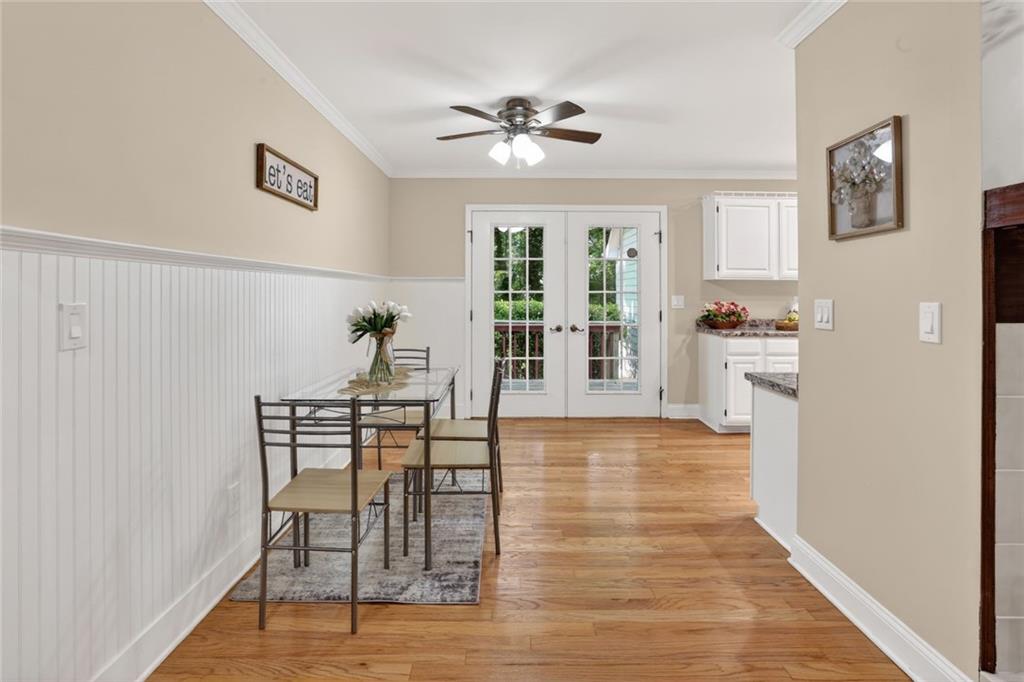 90 Hoglen Drive Covington, GA 30016 - Photo 11 of 28 a view of a livingroom with furniture wooden floor and a ceiling fan