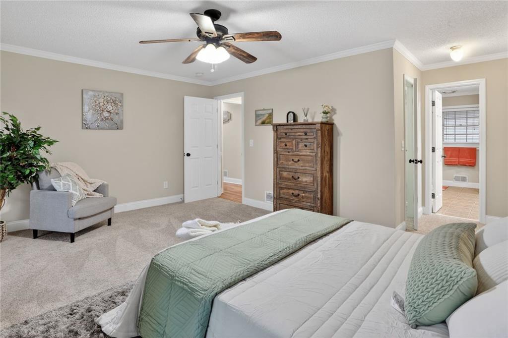 90 Hoglen Drive Covington, GA 30016 - Photo 14 of 28 a bedroom with a bed and a couch