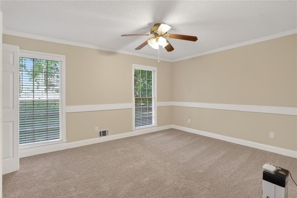90 Hoglen Drive Covington, GA 30016 - Photo 19 of 28 a view of an empty room with a window