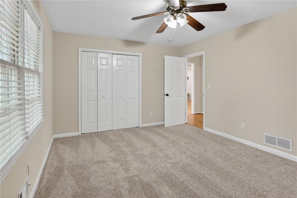 90 Hoglen Drive Covington, GA 30016 - Photo 22 of 28 a view of an empty room with a window