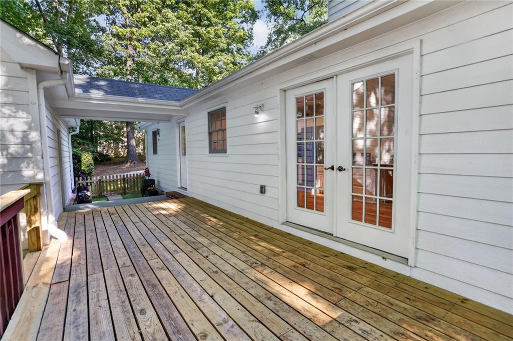 90 Hoglen Drive Covington, GA 30016 - Photo 24 of 28 a view of a house with a roof deck