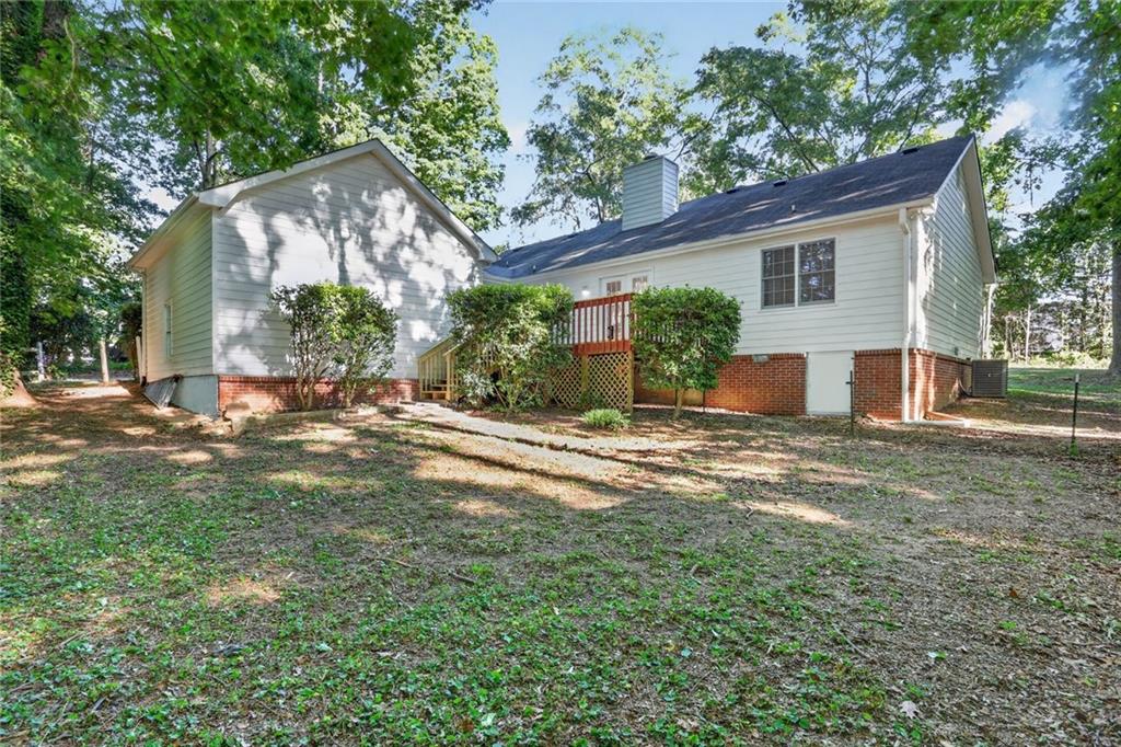 90 Hoglen Drive Covington, GA 30016 - Photo 26 of 28 a view of a house with a yard