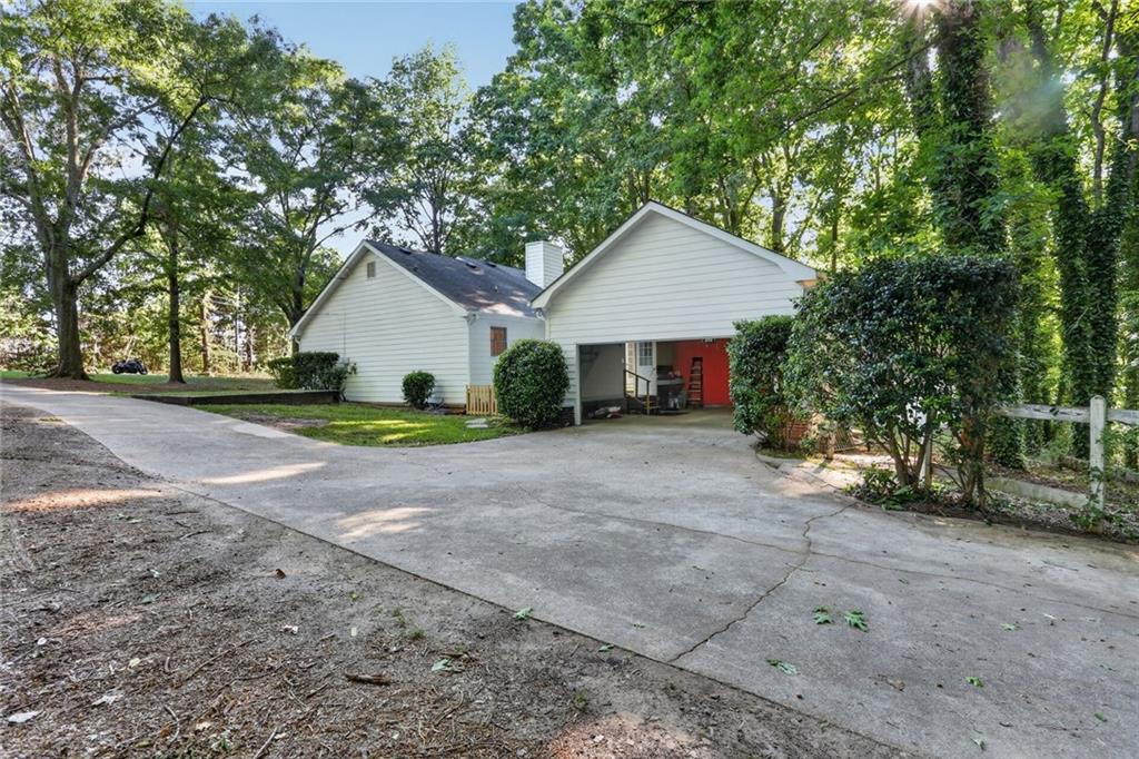 90 Hoglen Drive Covington, GA 30016 - Photo 27 of 28 a view of a house with yard and plants
