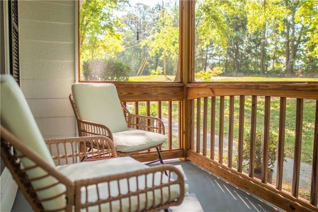 90 Hoglen Drive Covington, GA 30016 - Photo 3 of 28 a view of a chair in wooden deck