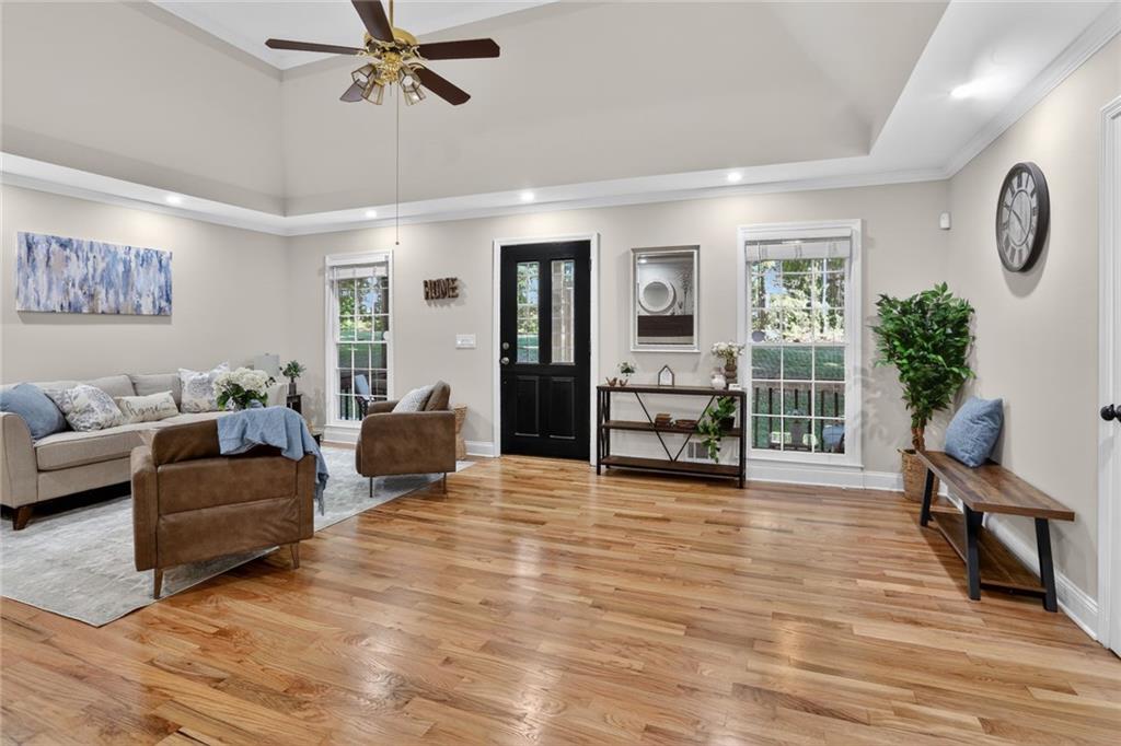 90 Hoglen Drive Covington, GA 30016 - Photo 5 of 28 a living room with furniture and a large window