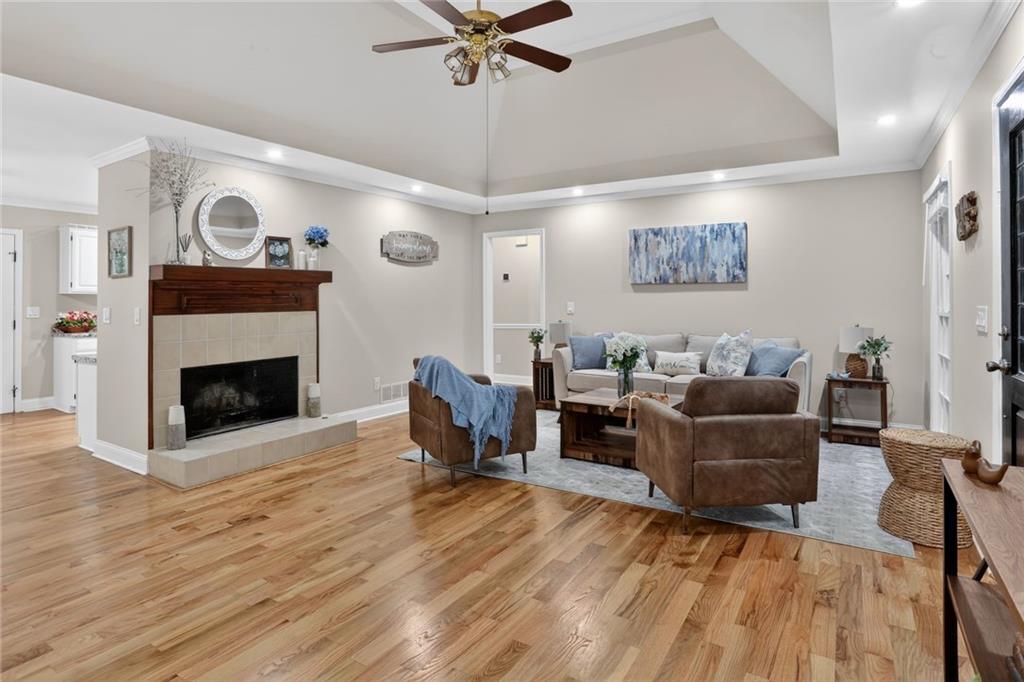 90 Hoglen Drive Covington, GA 30016 - Photo 6 of 28 a living room with furniture and a fireplace