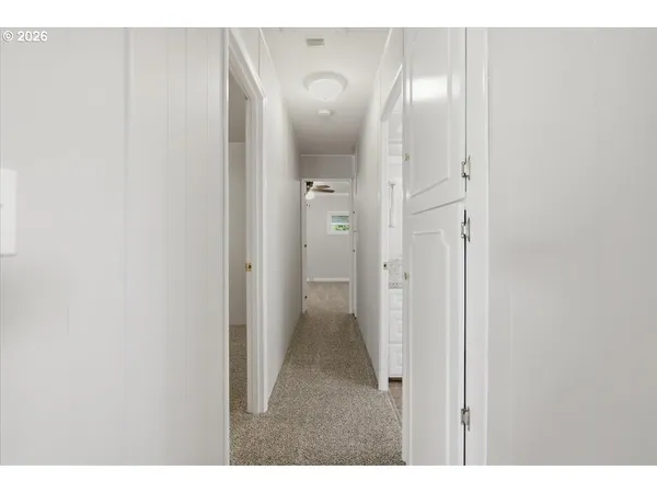 a view of a bathroom with a sink and mirror