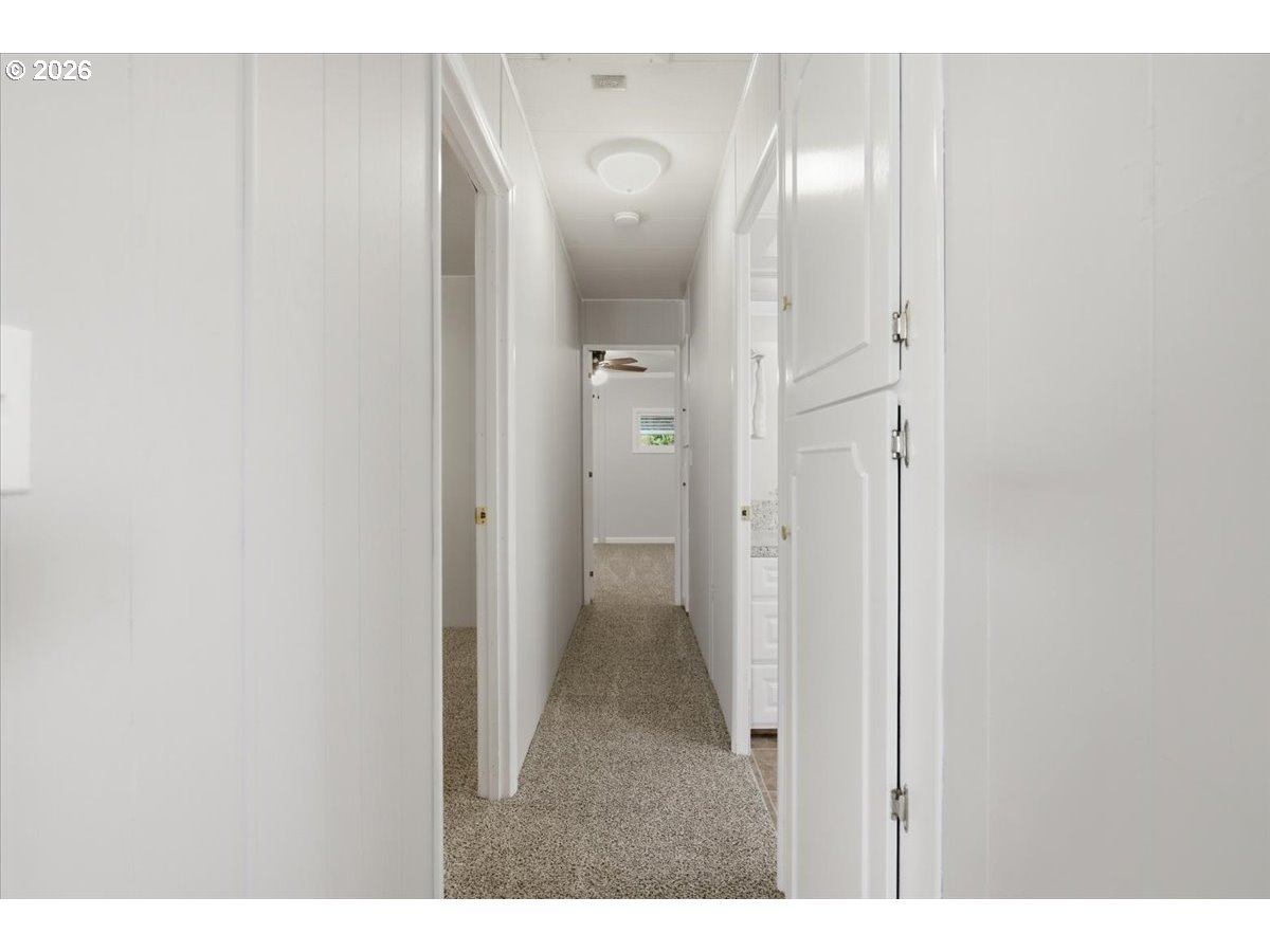 5422 Portland Road Northeast, Unit 33 Salem, OR 97305 - Photo 12 of 28 a view of a bathroom with a sink and mirror
