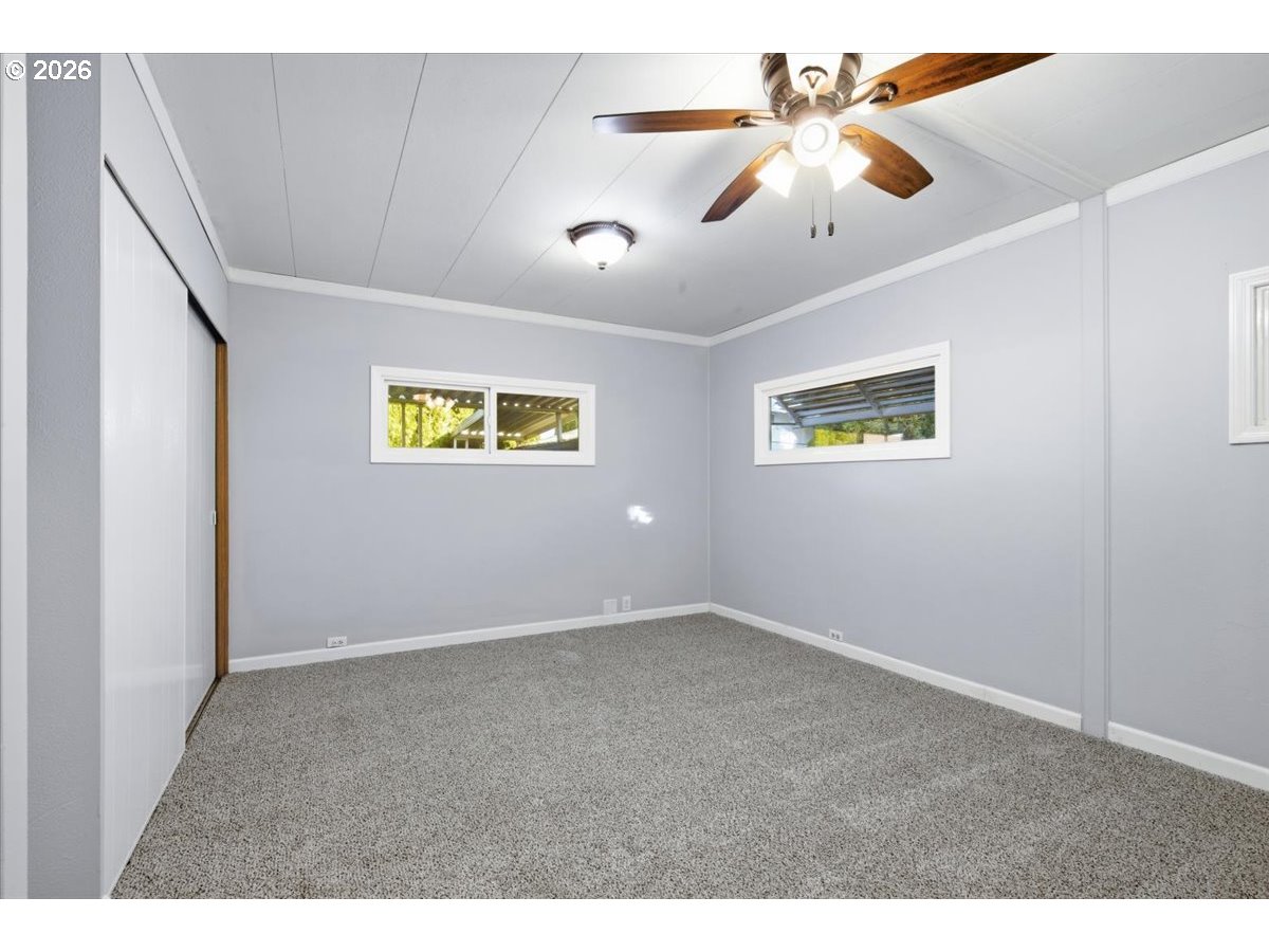 5422 Portland Road Northeast, Unit 33 Salem, OR 97305 - Photo 14 of 28 a view of an empty room with a window