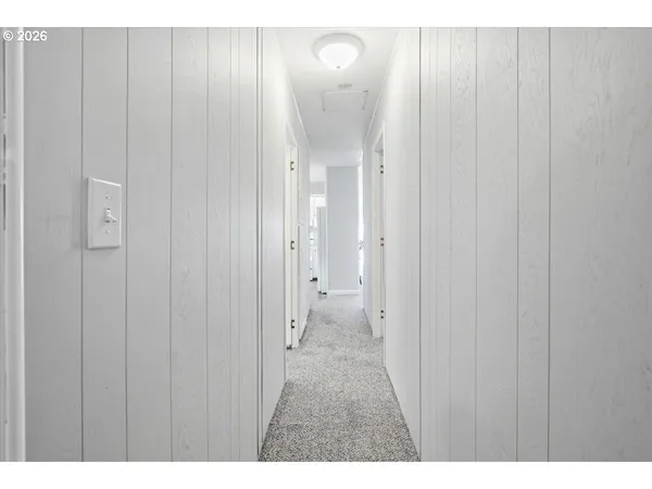 a view of a bathroom with a shower and a sink