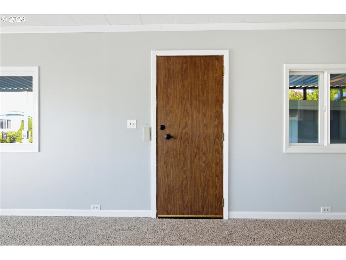 5422 Portland Road Northeast, Unit 33 Salem, OR 97305 - Photo 3 of 28 an empty room with windows
