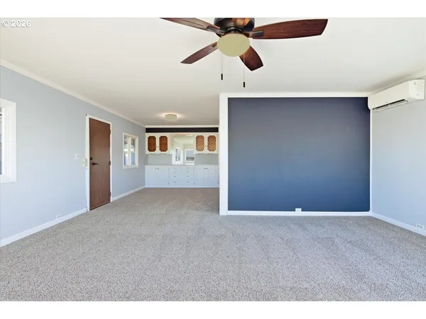 a view of an empty room with a window