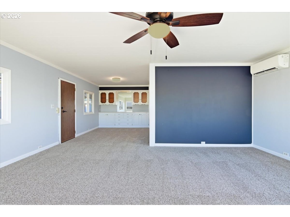 5422 Portland Road Northeast, Unit 33 Salem, OR 97305 - Photo 5 of 28 a view of an empty room with a window