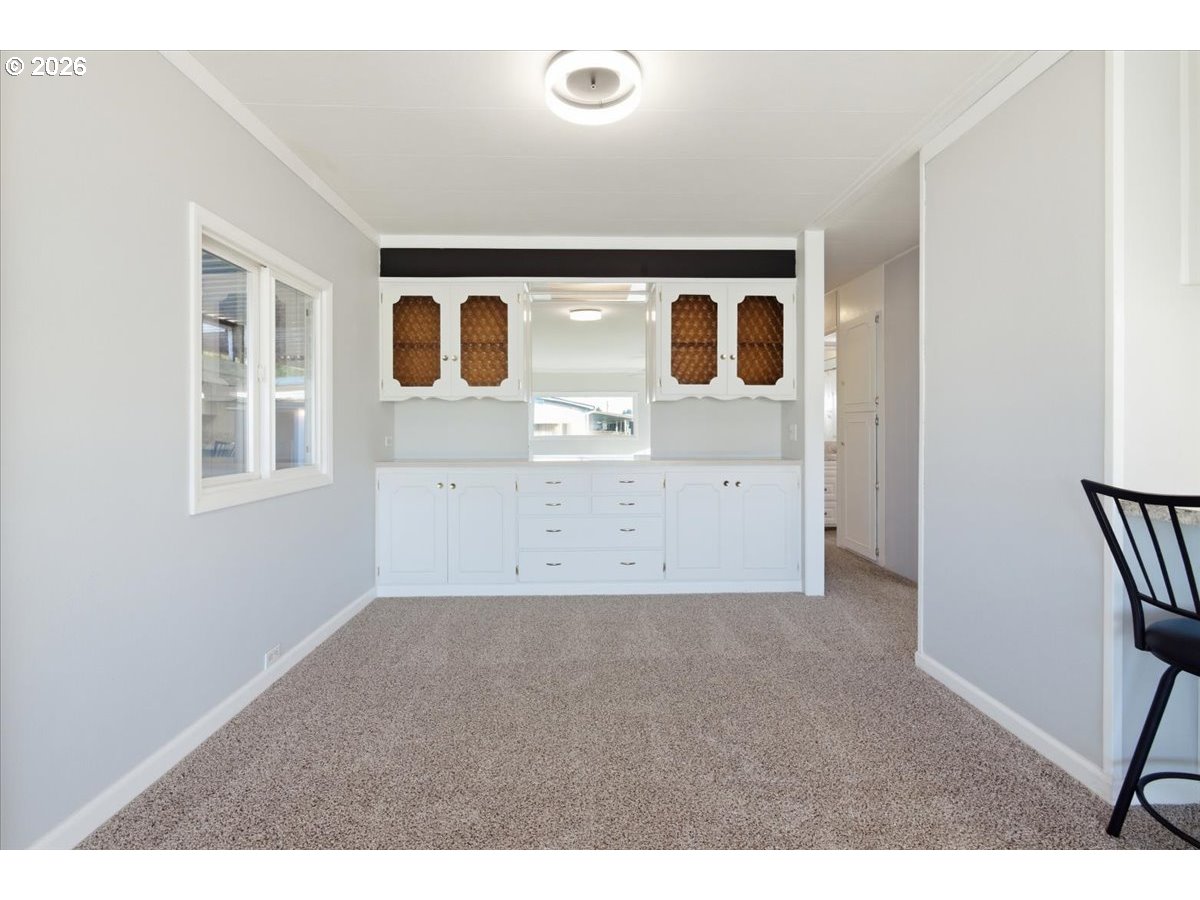 5422 Portland Road Northeast, Unit 33 Salem, OR 97305 - Photo 6 of 28 a view of kitchen with wooden cabinet