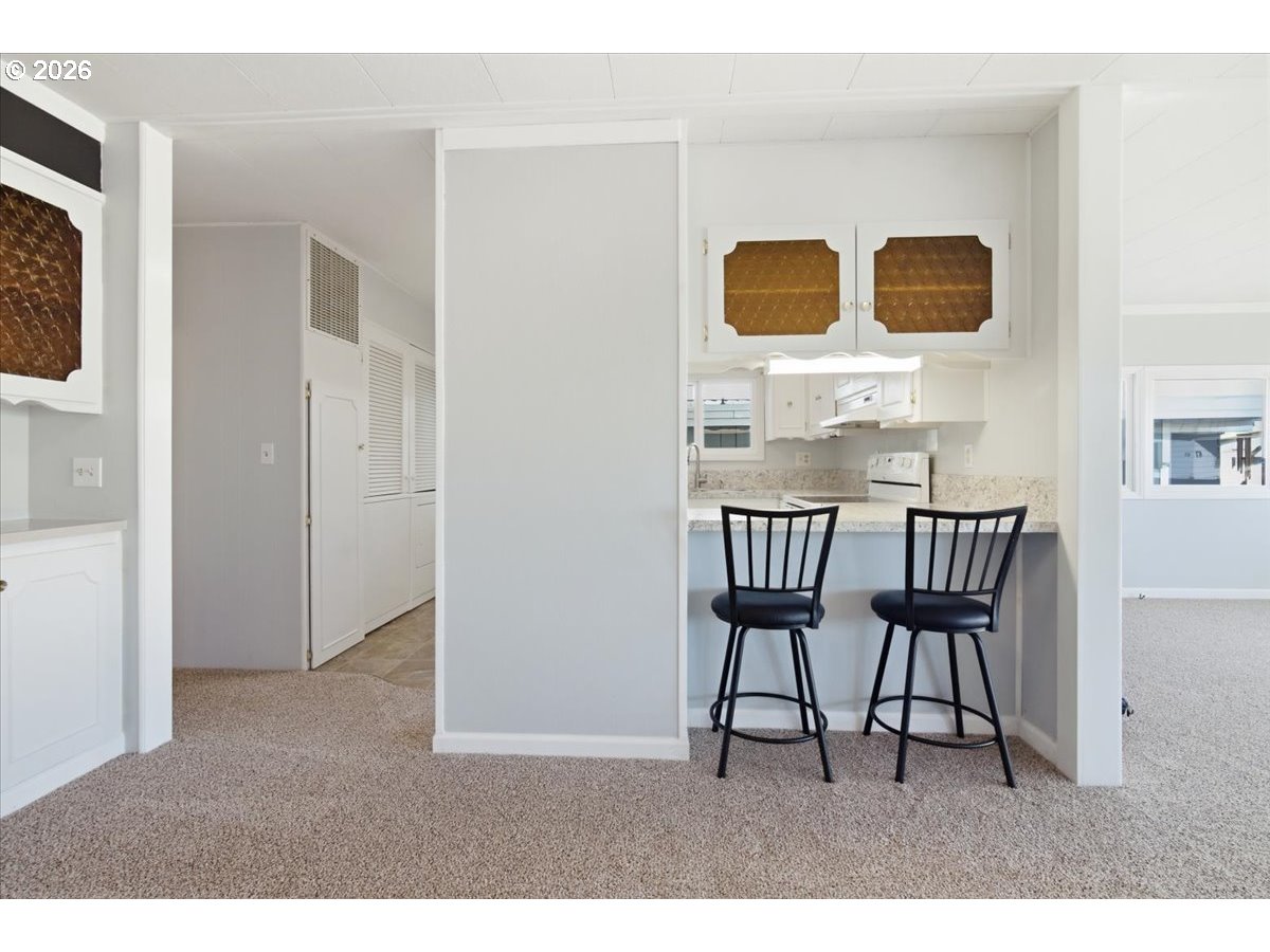 5422 Portland Road Northeast, Unit 33 Salem, OR 97305 - Photo 7 of 28 a dining room with furniture and wooden floor