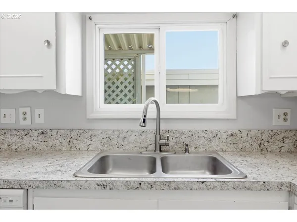 a kitchen with sink and window