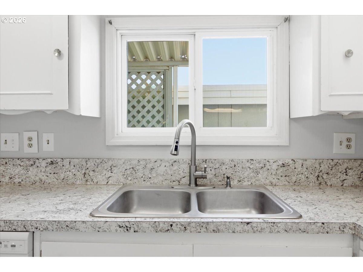 5422 Portland Road Northeast, Unit 33 Salem, OR 97305 - Photo 10 of 28 a kitchen with sink and window