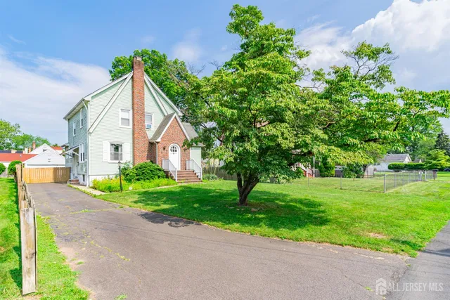 a view of a house with a yard and plants