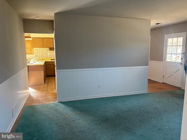 a room with a bed and a chandelier