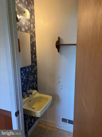 a bathroom with a toilet and a sink