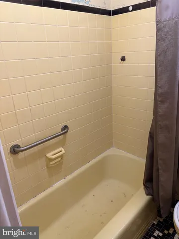 a room with wooden floor and window