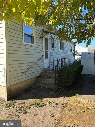 a view of a backyard of the house