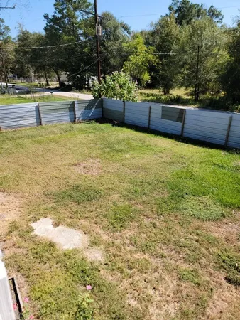 a view of a swimming pool with an outdoor seating and a garden