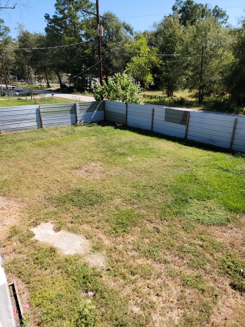 26643 Carol Lane Splendora, TX 77372 - Photo 4 of 14 a view of a swimming pool with an outdoor seating and a garden