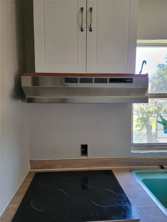 a view of cabinets and window