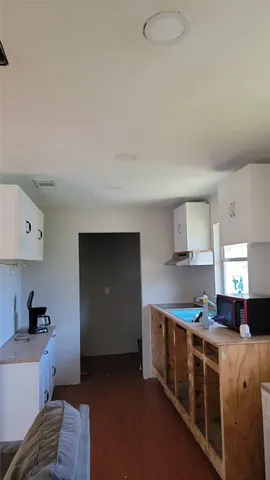 a kitchen with stainless steel appliances granite countertop a stove and a refrigerator