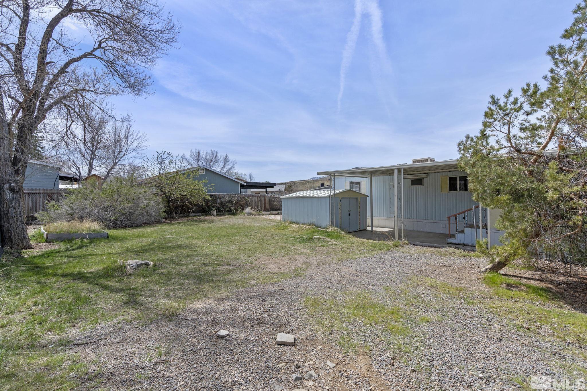 265 Taurus Circle Reno, NV 89521 - Photo 24 of 28 a backyard of a house with lots of green space
