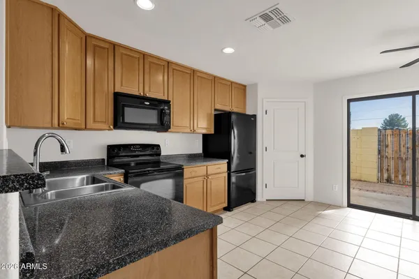 a kitchen with a sink a stove and refrigerator