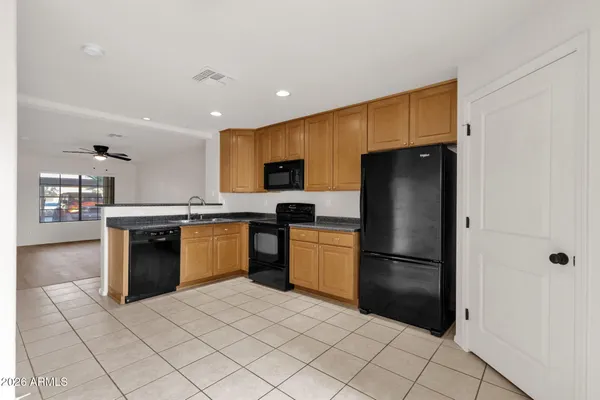 a kitchen with a refrigerator sink and microwave