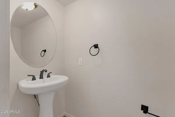 a bathroom with a sink and mirror