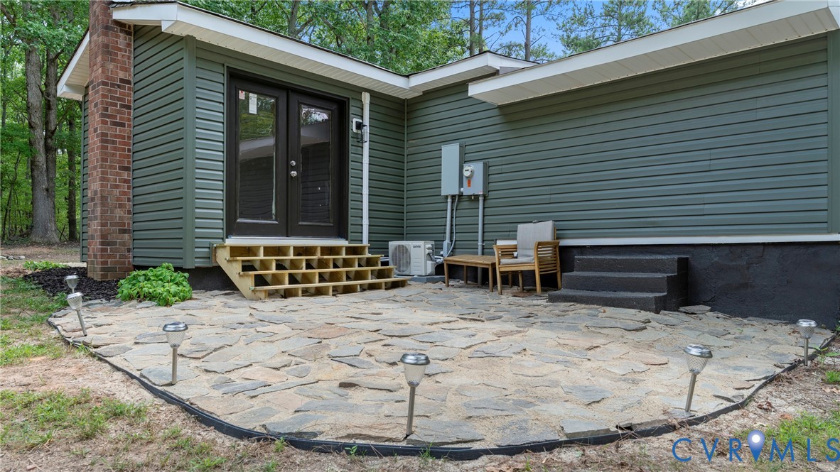 11550 Lunenburg County Road Keysville, VA 23947 - Photo 9 of 48 Expansive stone patio with solar path lighting, co