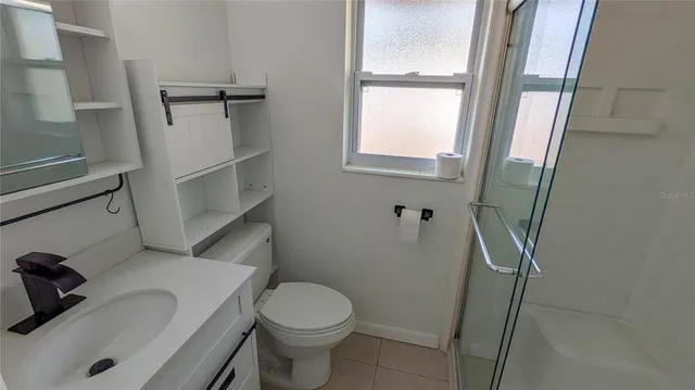 a bathroom with a sink and toilet