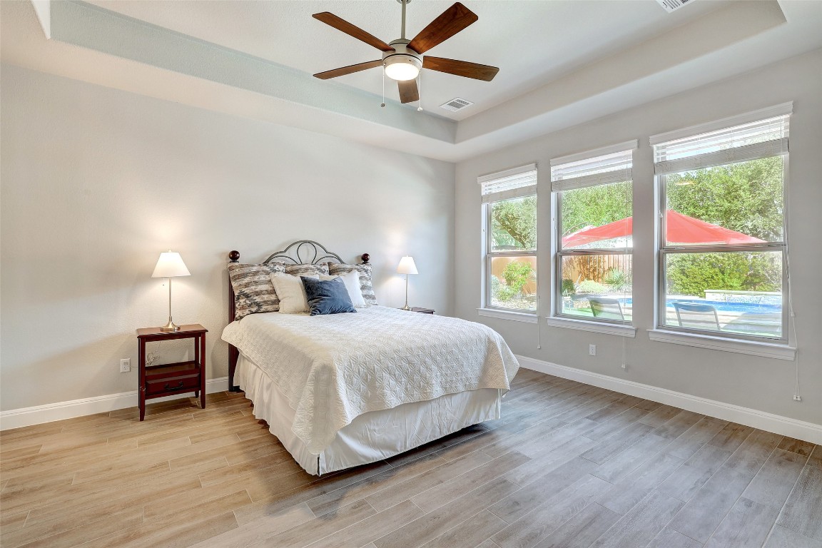 257 Axis Loop Georgetown, TX 78628 - Photo 13 of 40 a bedroom with a bed and window