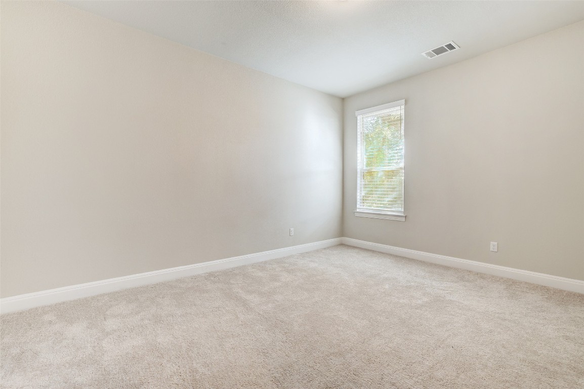 257 Axis Loop Georgetown, TX 78628 - Photo 20 of 40 a view of an empty room with a window