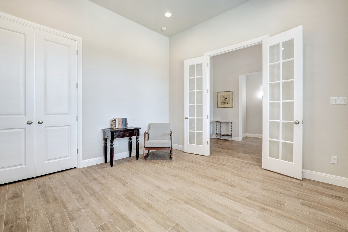 257 Axis Loop Georgetown, TX 78628 - Photo 24 of 40 an empty room with wooden floor and windows