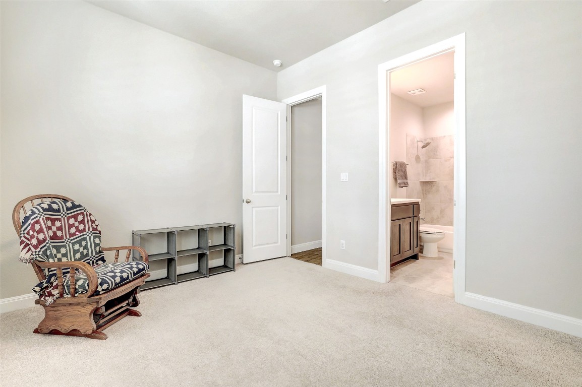 257 Axis Loop Georgetown, TX 78628 - Photo 27 of 40 a view of a livingroom with a chair and painted walls