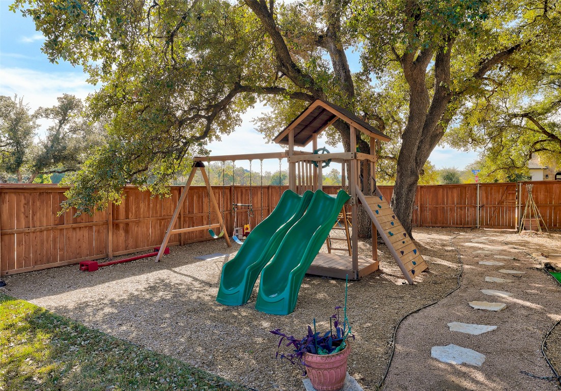 257 Axis Loop Georgetown, TX 78628 - Photo 3 of 40 a view of a backyard with a slide