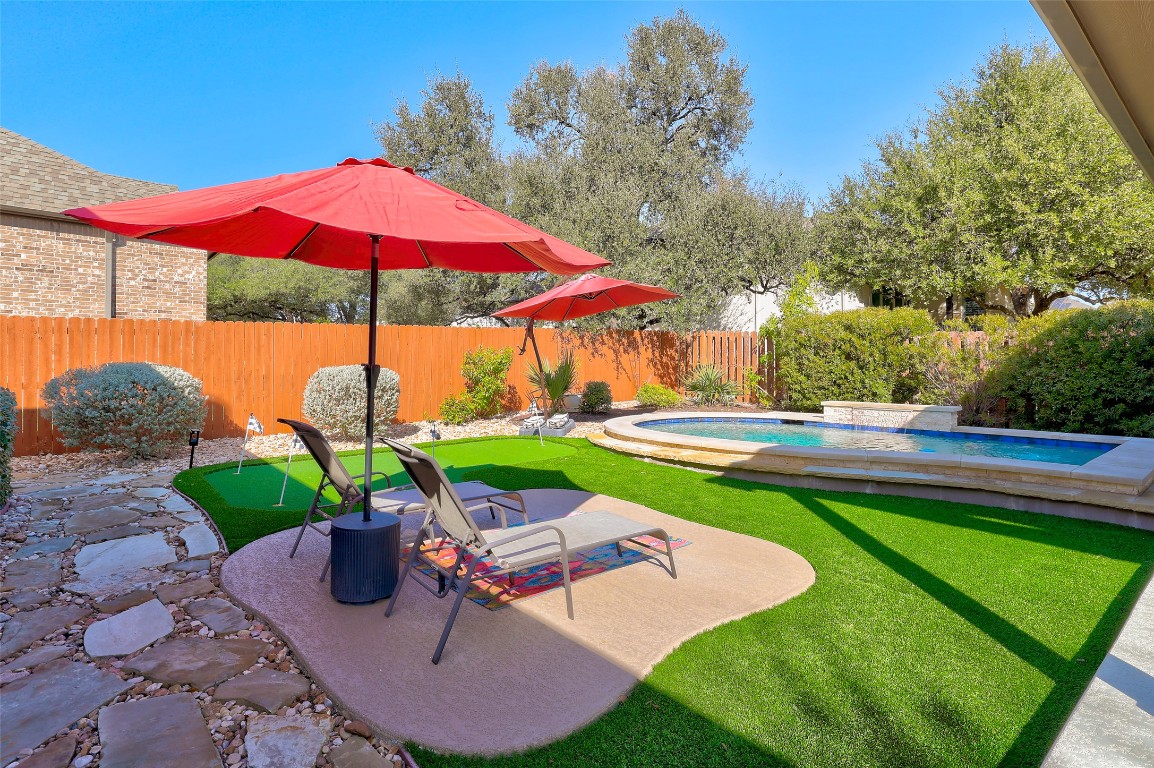 257 Axis Loop Georgetown, TX 78628 - Photo 35 of 40 a view of a backyard with sitting area and furniture