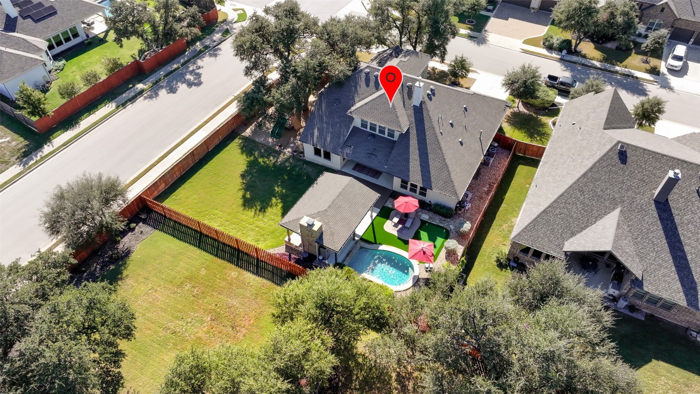 257 Axis Loop Georgetown, TX 78628 - Photo 38 of 40 an aerial view of a house with a yard and potted plants