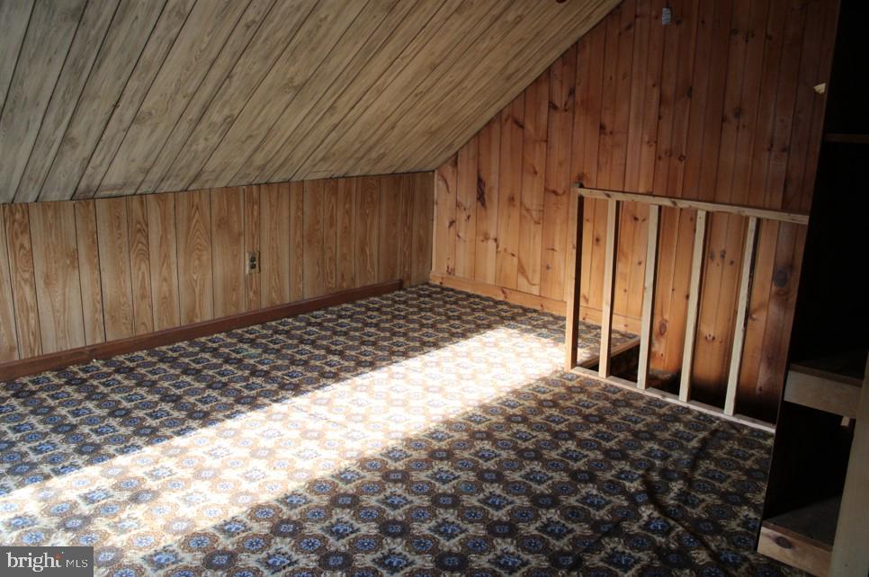 2456 Seven Valleys Road, Unit 1 Seven Valleys, PA 17360 - Photo 7 of 7 a bedroom with a bed and wooden floor