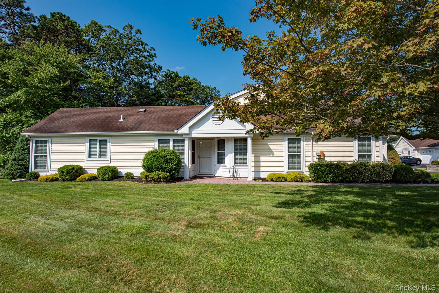 25 Douglaston Court Ridge, NY 11961 - Photo 1 of 1 View of front of house with a front lawn