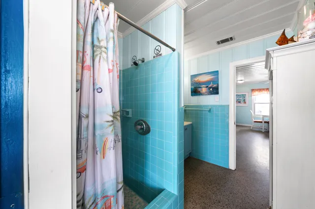 a view of a backyard with a patio and a garden