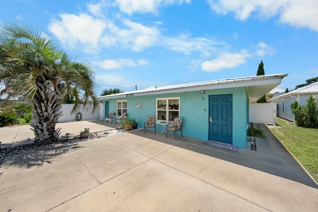 a kitchen with refrigerator and cabinets
