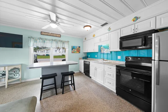 a large bedroom with a bed and a flat screen tv