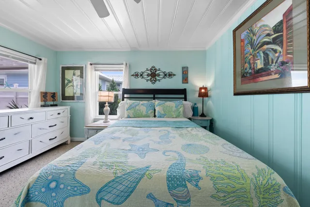 a view of a house and a table and chair in the patio